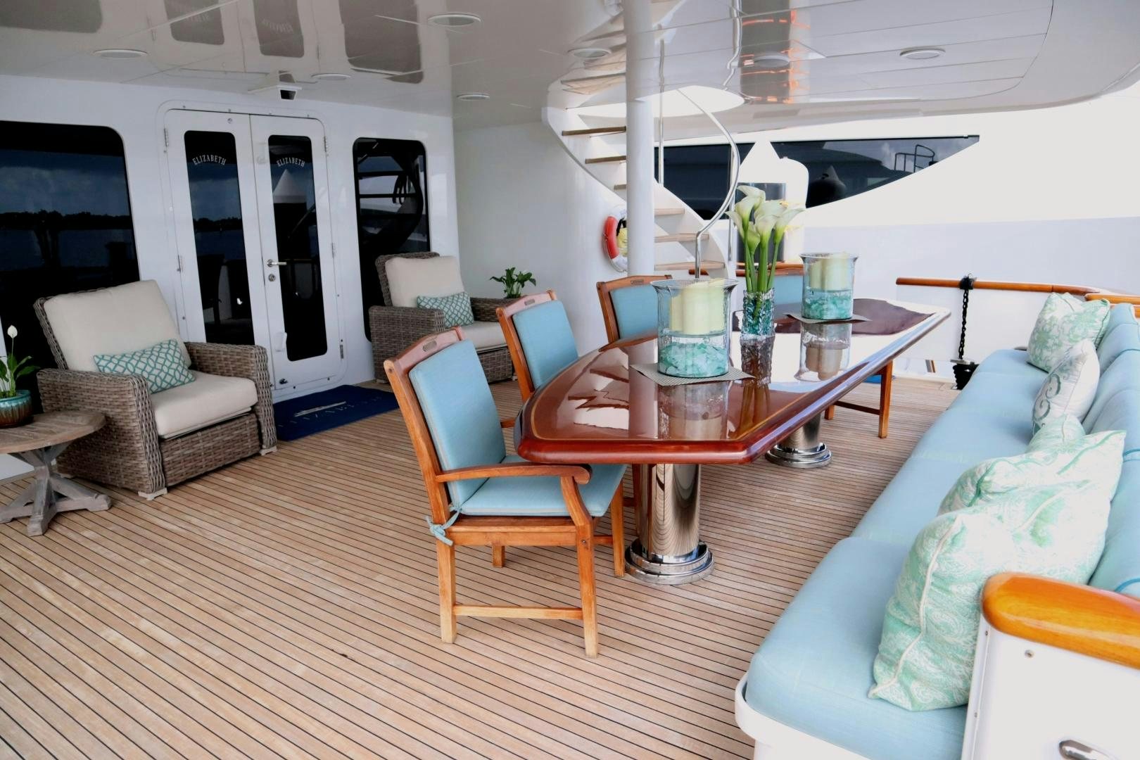 a living room with a table and chairs aboard ELIZABETH Yacht for Sale