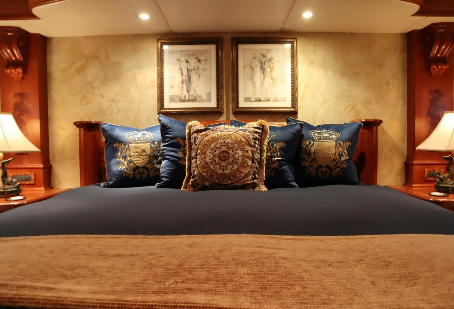 a bed with a blue pillow aboard ELIZABETH Yacht for Sale