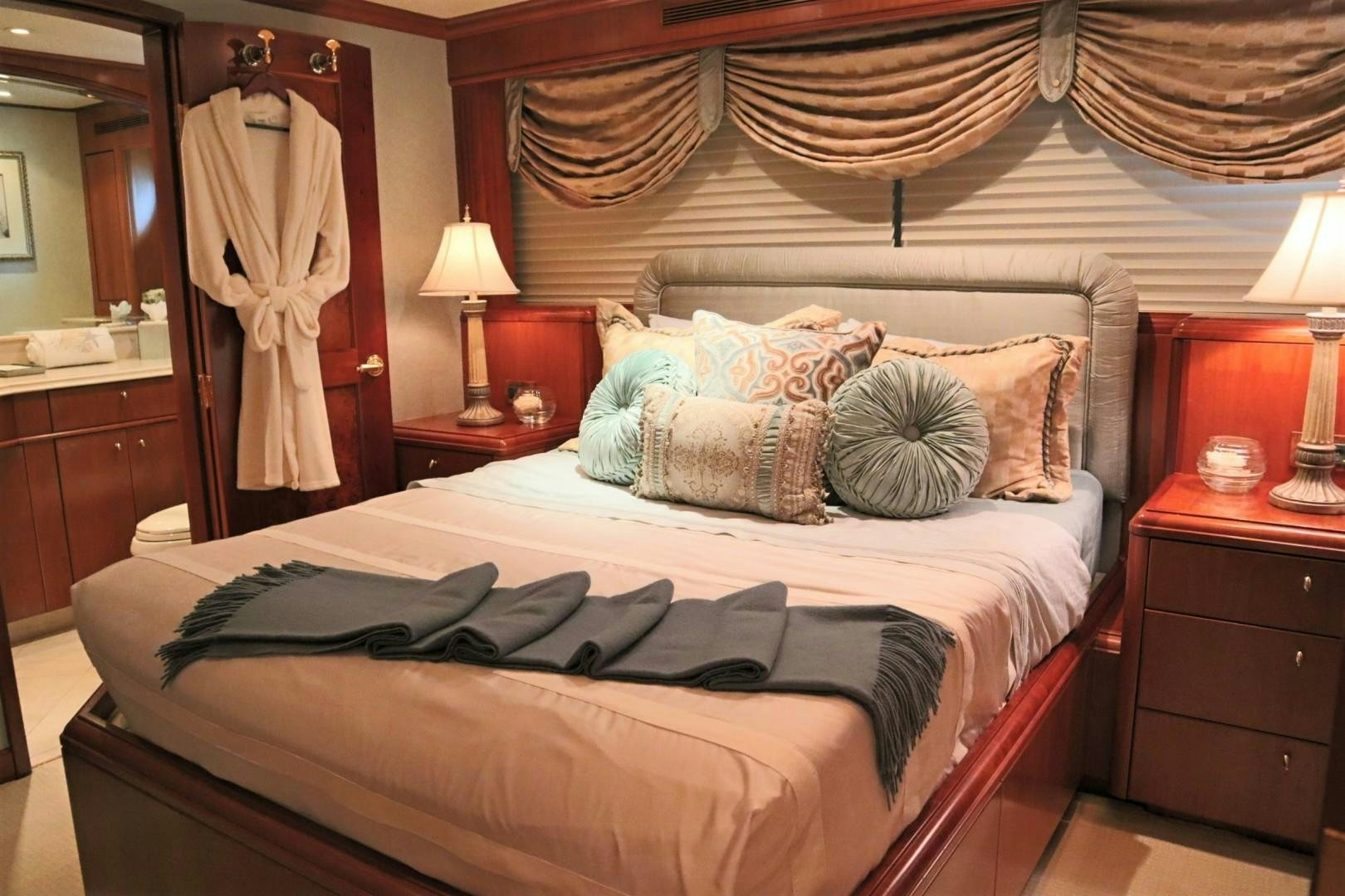 a bed with pillows and blankets aboard ELIZABETH Yacht for Sale