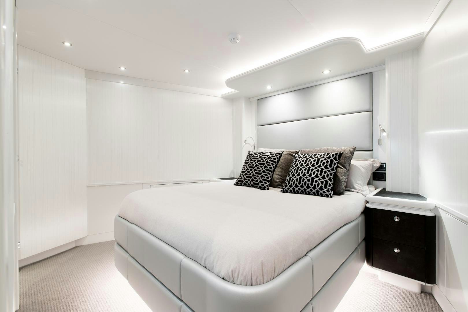 a white bedroom with a bed aboard CRESCENT 117 Yacht for Sale