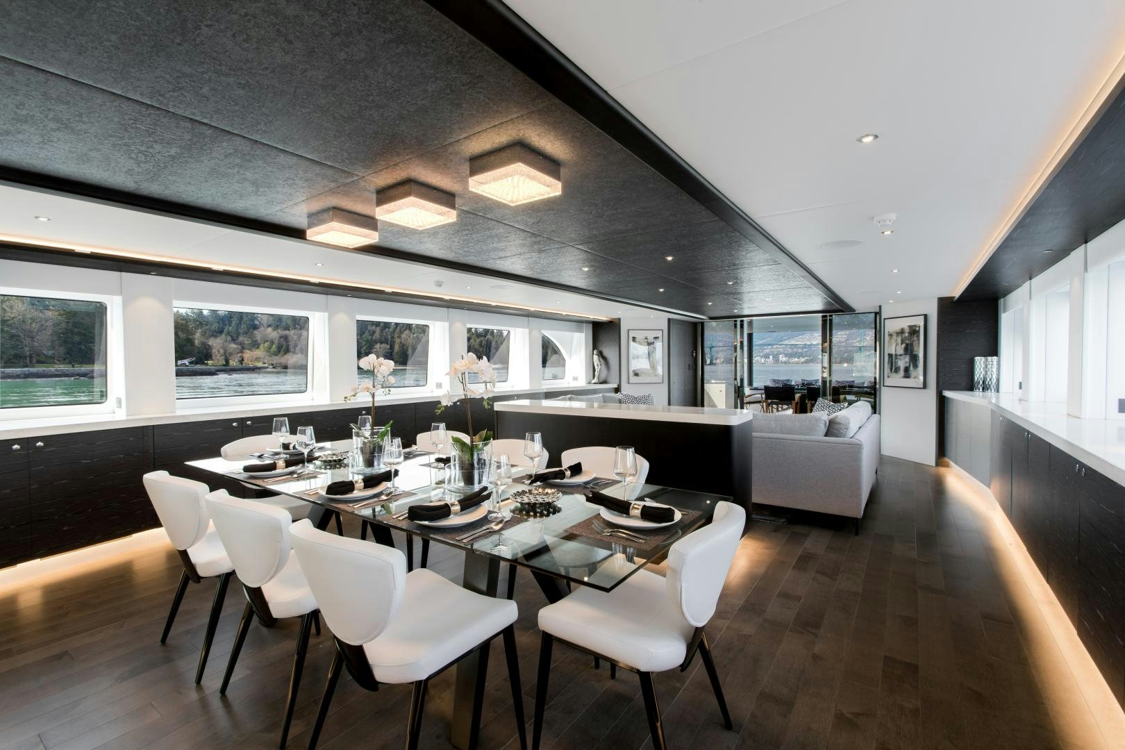 a large dining room with a large table and chairs aboard CRESCENT 117 Yacht for Sale