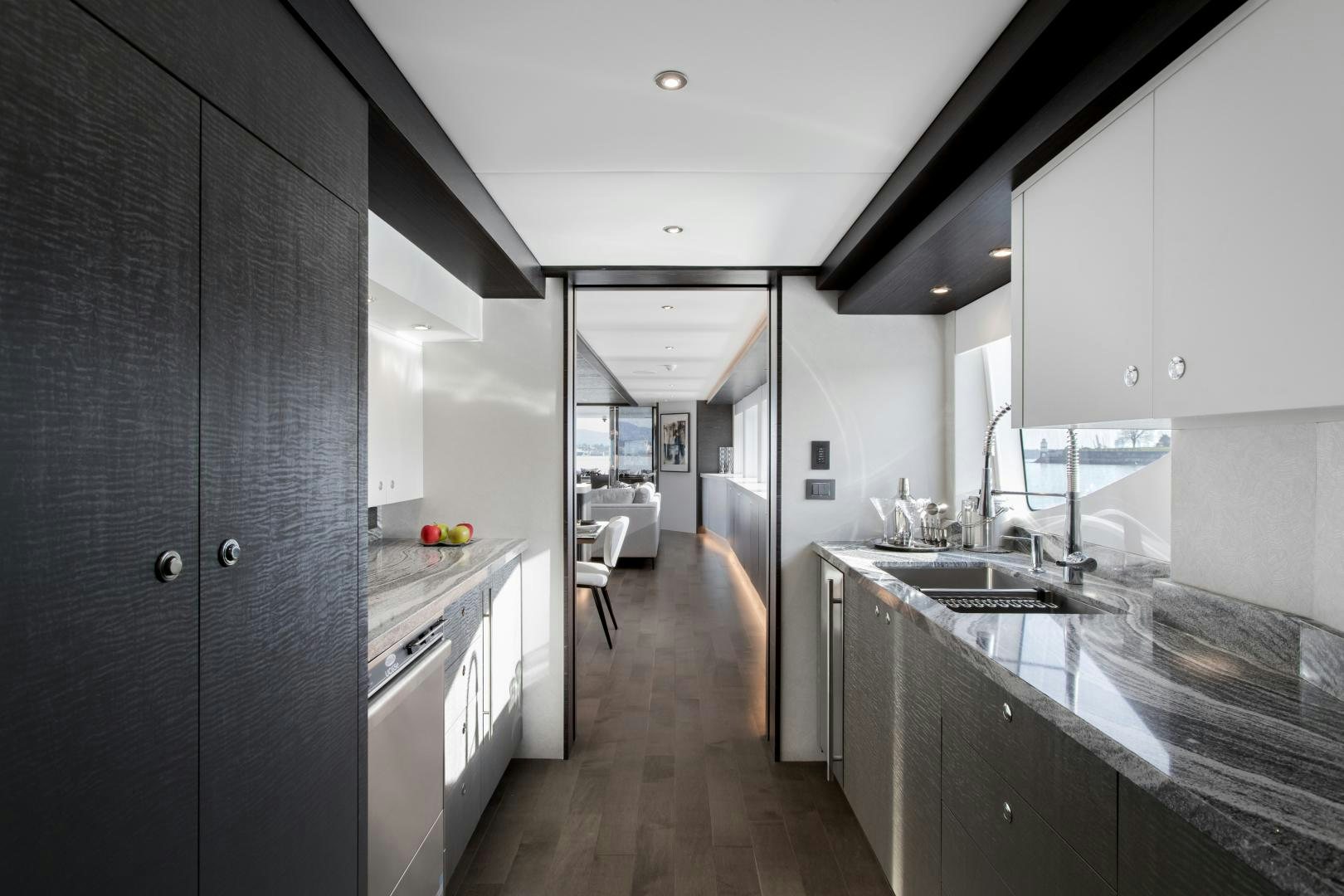 a kitchen with a large island aboard CRESCENT 117 Yacht for Sale
