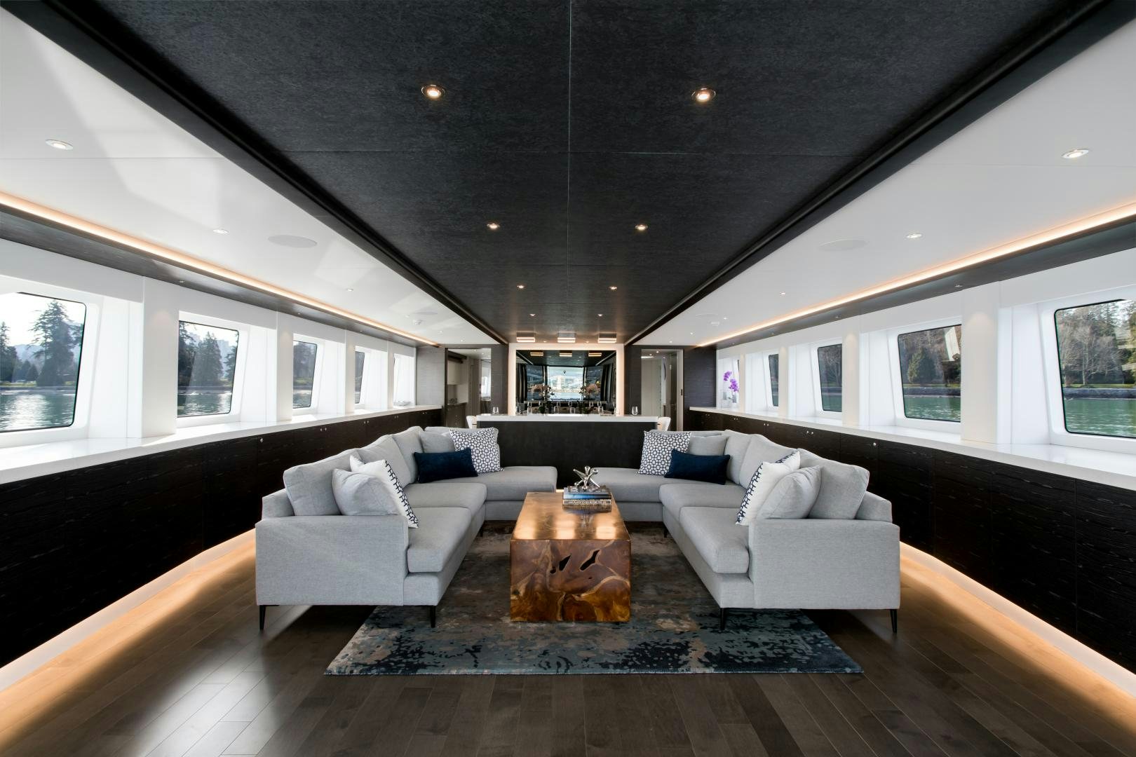 a living room with a large ceiling aboard CRESCENT 117 Yacht for Sale