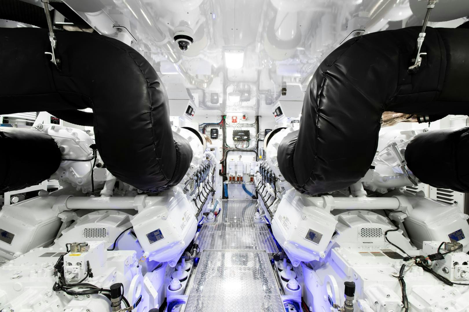 a person standing in front of a display of electronics aboard CRESCENT 117 Yacht for Sale