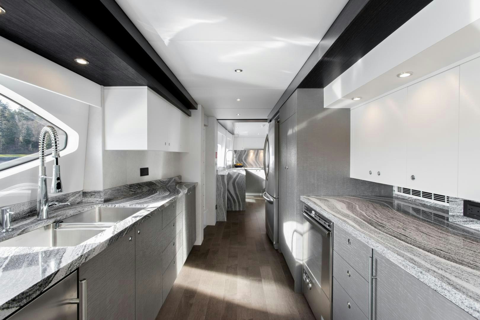 a kitchen with a sink and a bathtub aboard CRESCENT 117 Yacht for Sale