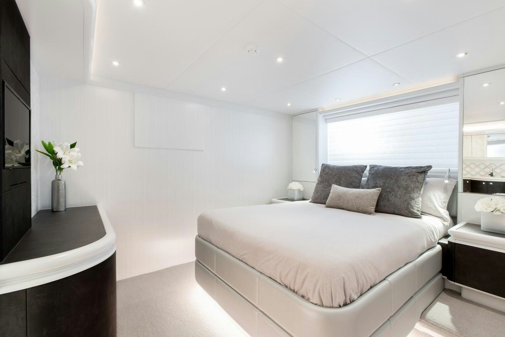 a white bedroom with a bed aboard CRESCENT 117 Yacht for Sale