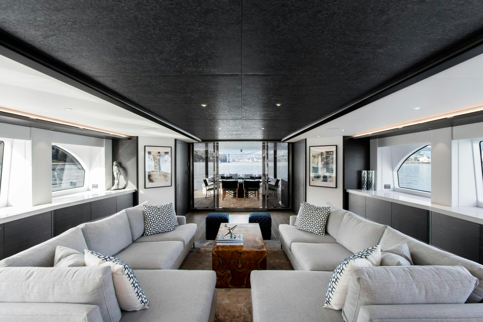 a living room with a large window aboard CRESCENT 117 Yacht for Sale