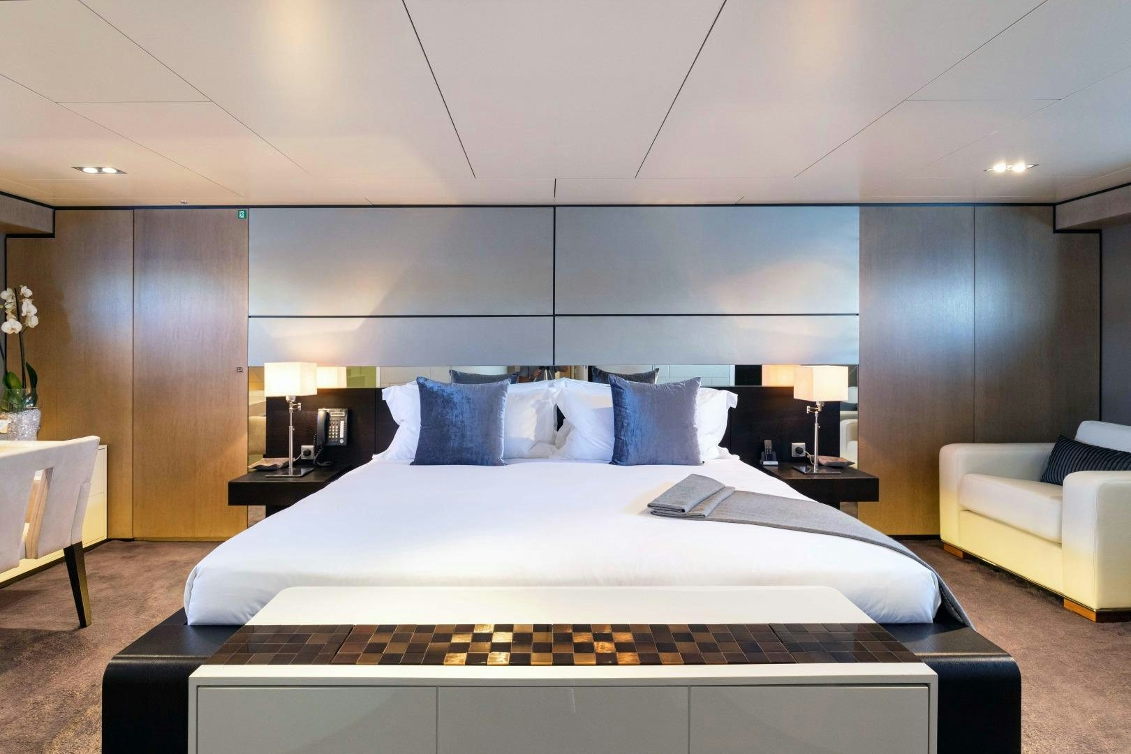 a large bed in a hotel room aboard TOMMY BELLE Yacht for Sale