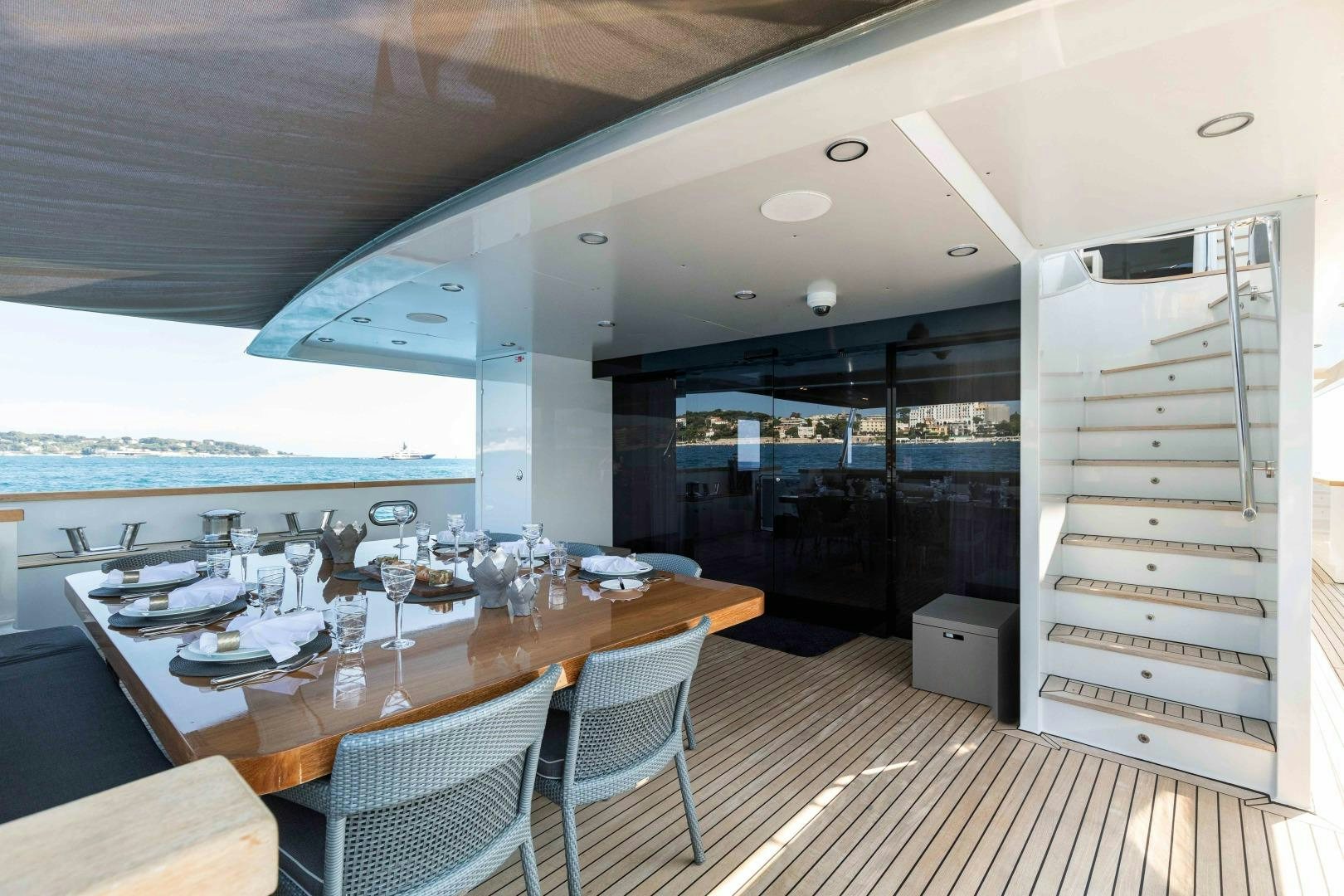 a dining table in a room aboard TOMMY BELLE Yacht for Sale