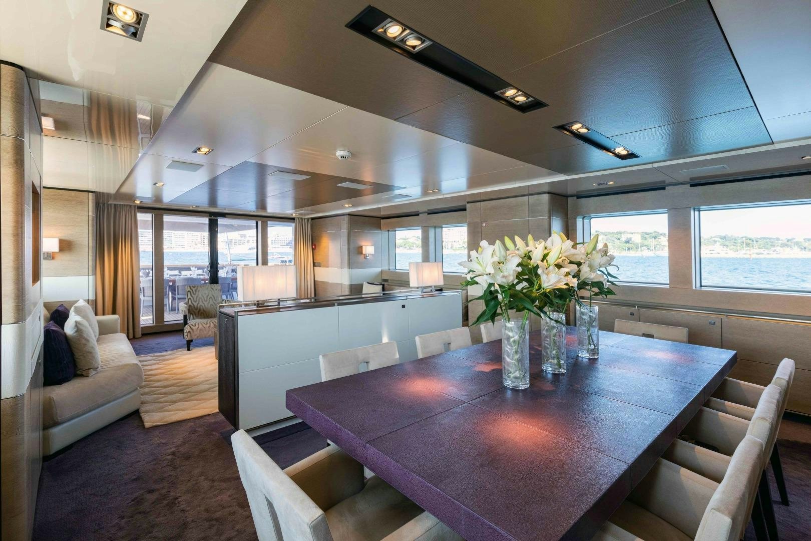 a room with a table and chairs aboard TOMMY BELLE Yacht for Sale
