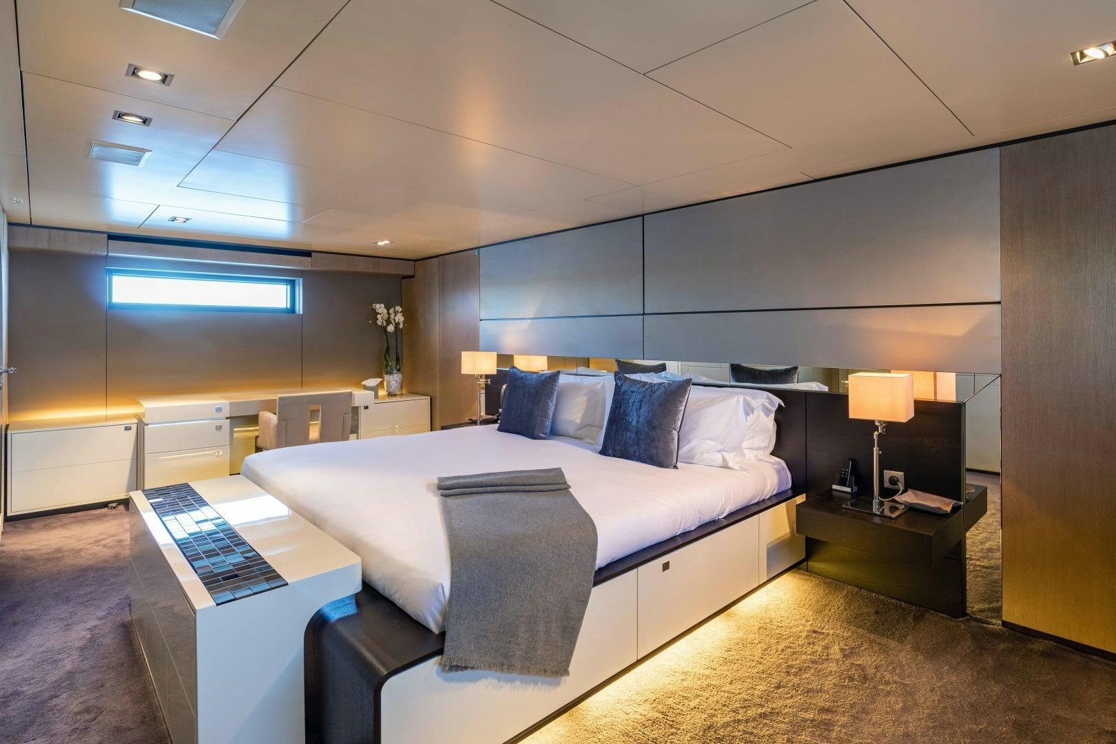 a bedroom with a large bed aboard TOMMY BELLE Yacht for Sale