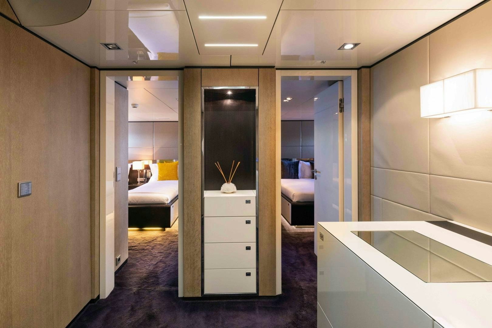 a room with a bed and a mirror aboard TOMMY BELLE Yacht for Sale