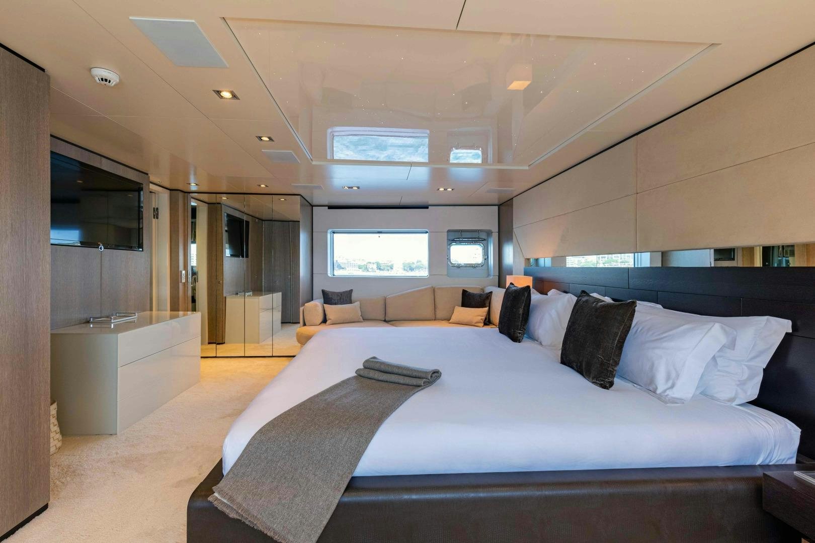 a large bed in a room aboard TOMMY BELLE Yacht for Sale