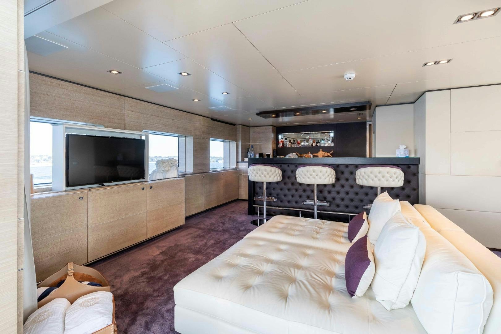 a bedroom with a large bed aboard TOMMY BELLE Yacht for Sale