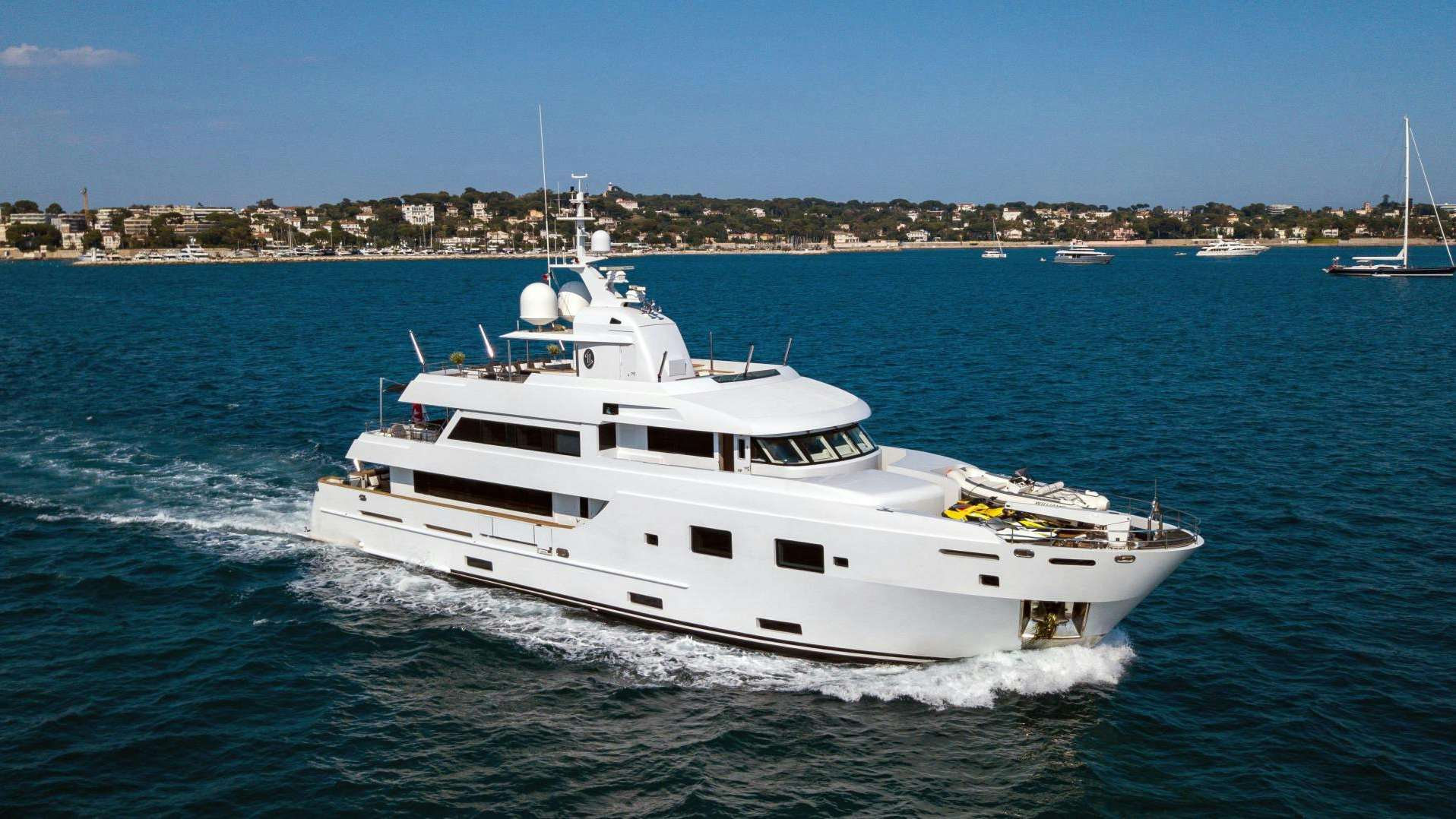 a white yacht on the water aboard TOMMY BELLE Yacht for Sale
