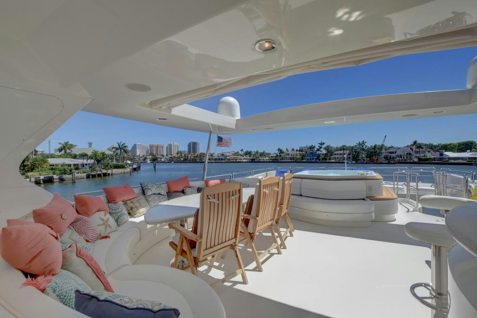 a room with a view of a city and a large pool aboard SIN OR SWIM Yacht for Sale