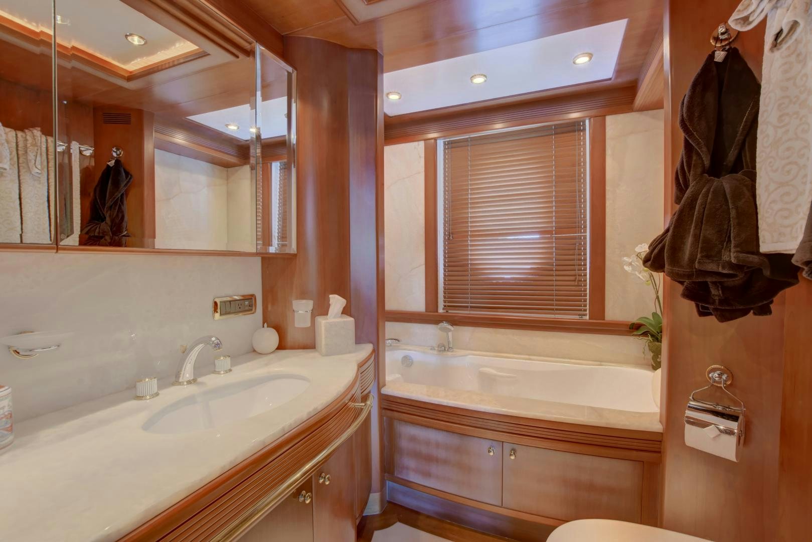 a bathroom with a large mirror aboard SIN OR SWIM Yacht for Sale