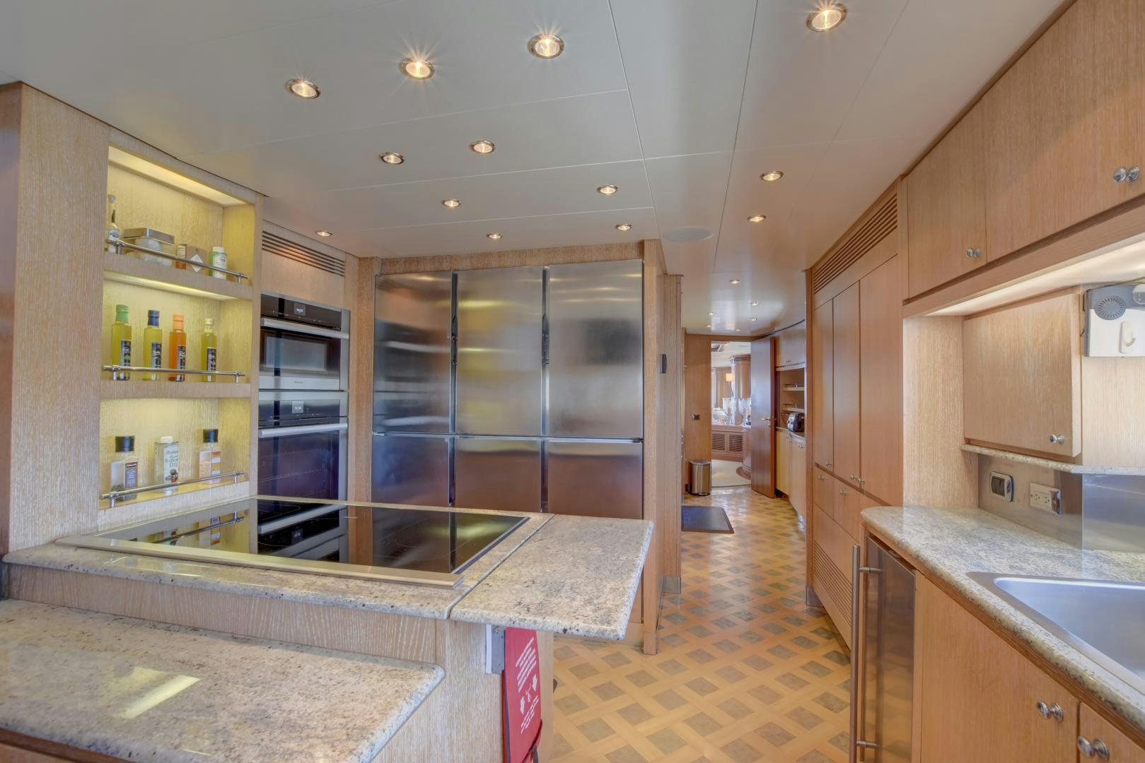a kitchen with a glass shower aboard SIN OR SWIM Yacht for Sale