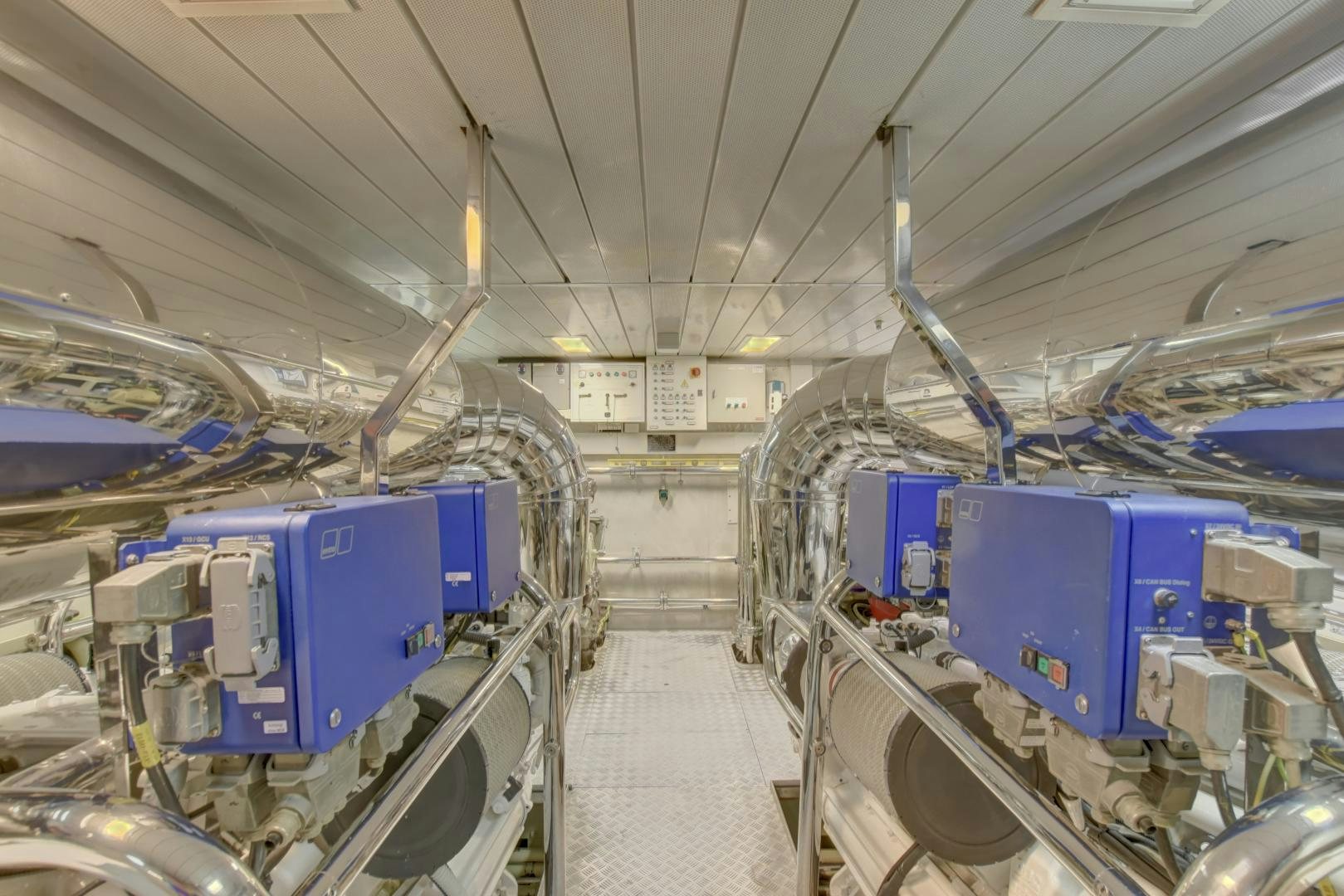 a large room with several blue containers aboard SIN OR SWIM Yacht for Sale