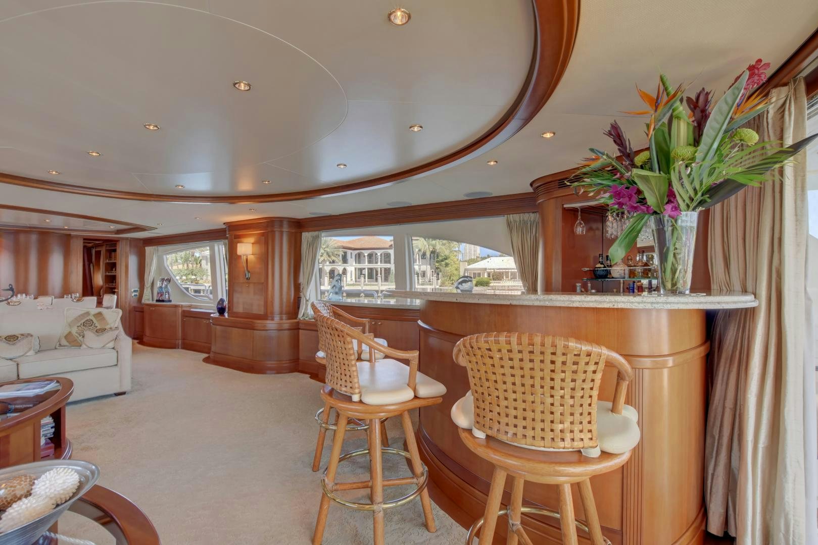 a room with a table chairs and a bed aboard SIN OR SWIM Yacht for Sale