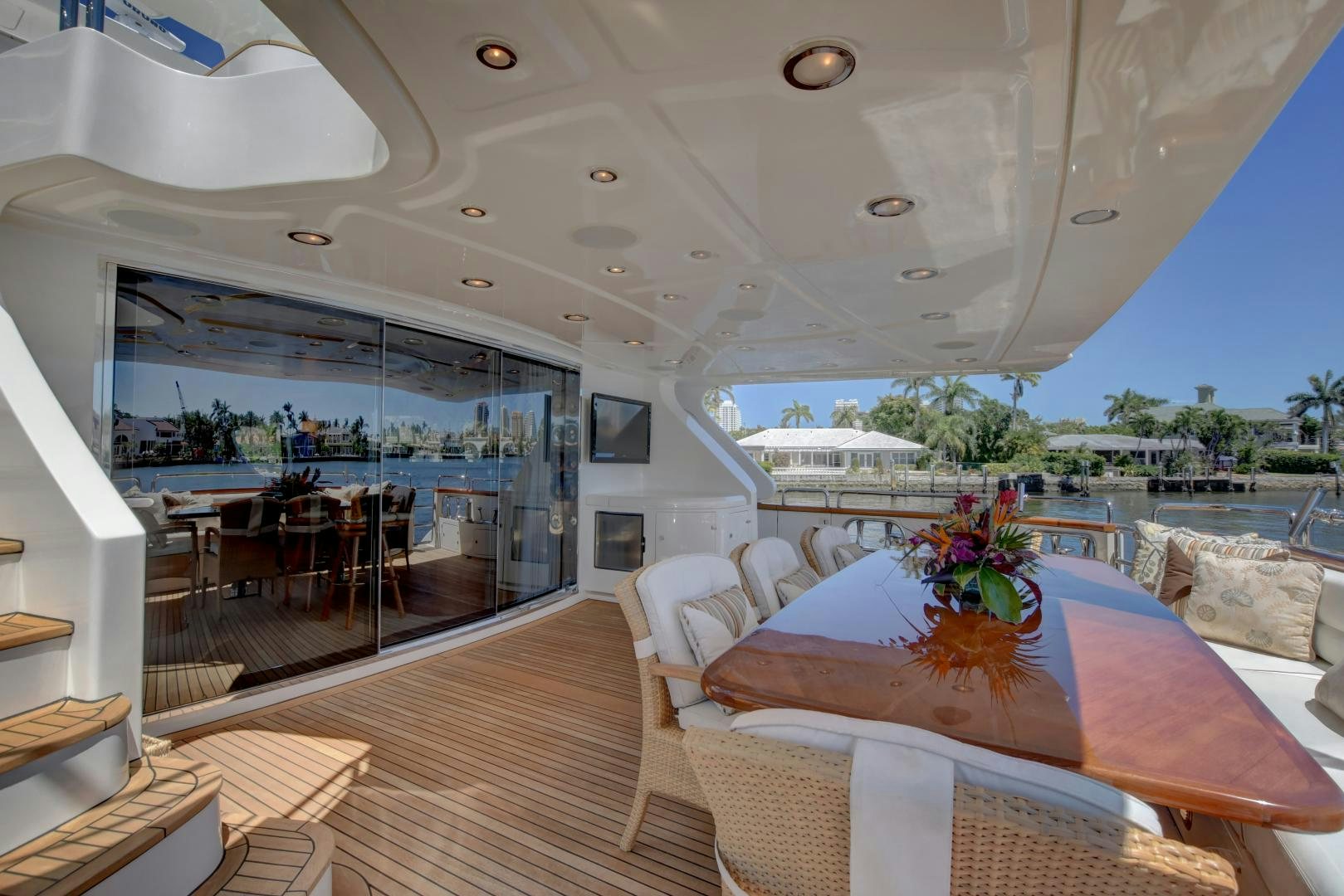 a large living room with a large balcony aboard SIN OR SWIM Yacht for Sale