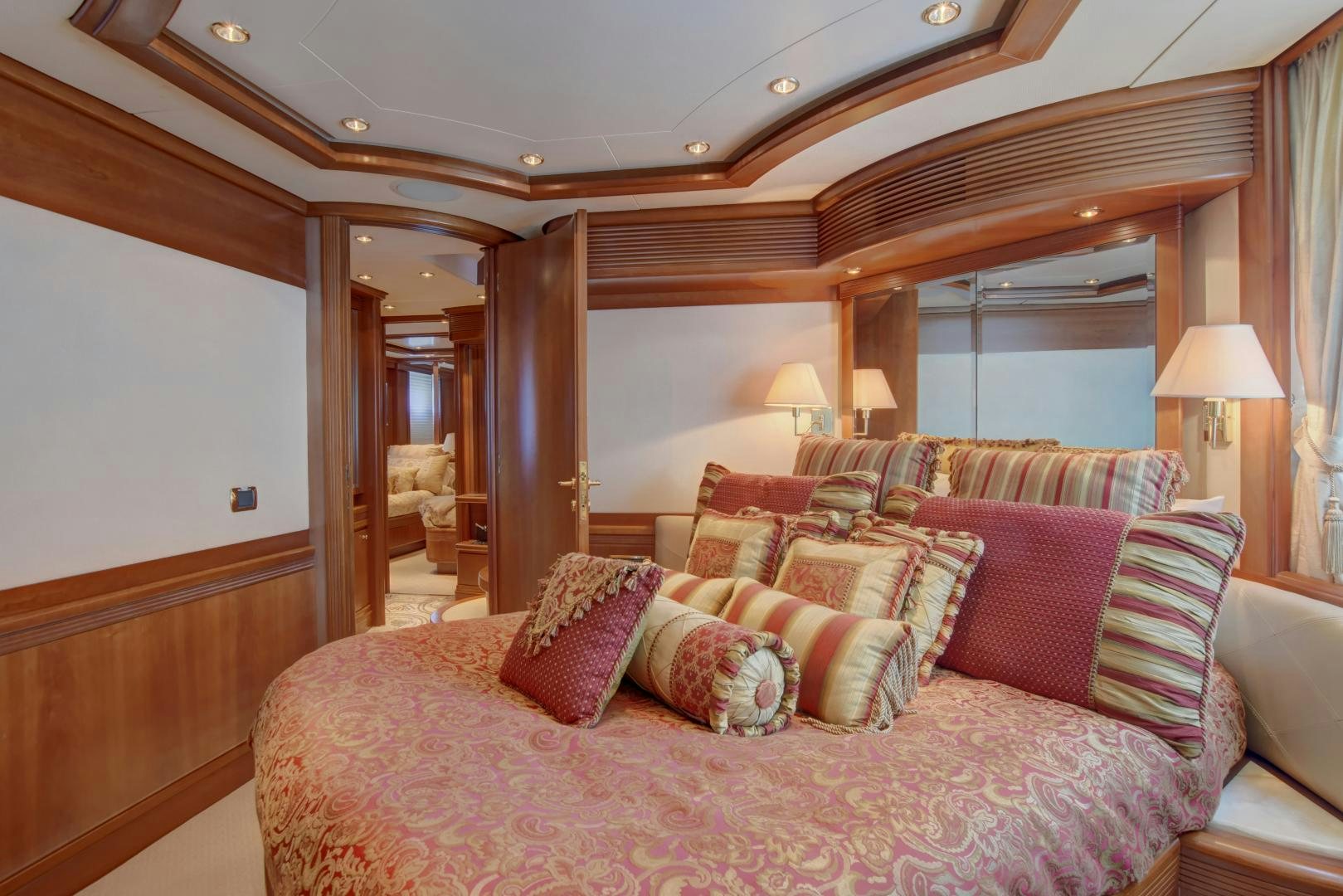 a bed with pillows and blankets aboard SIN OR SWIM Yacht for Sale
