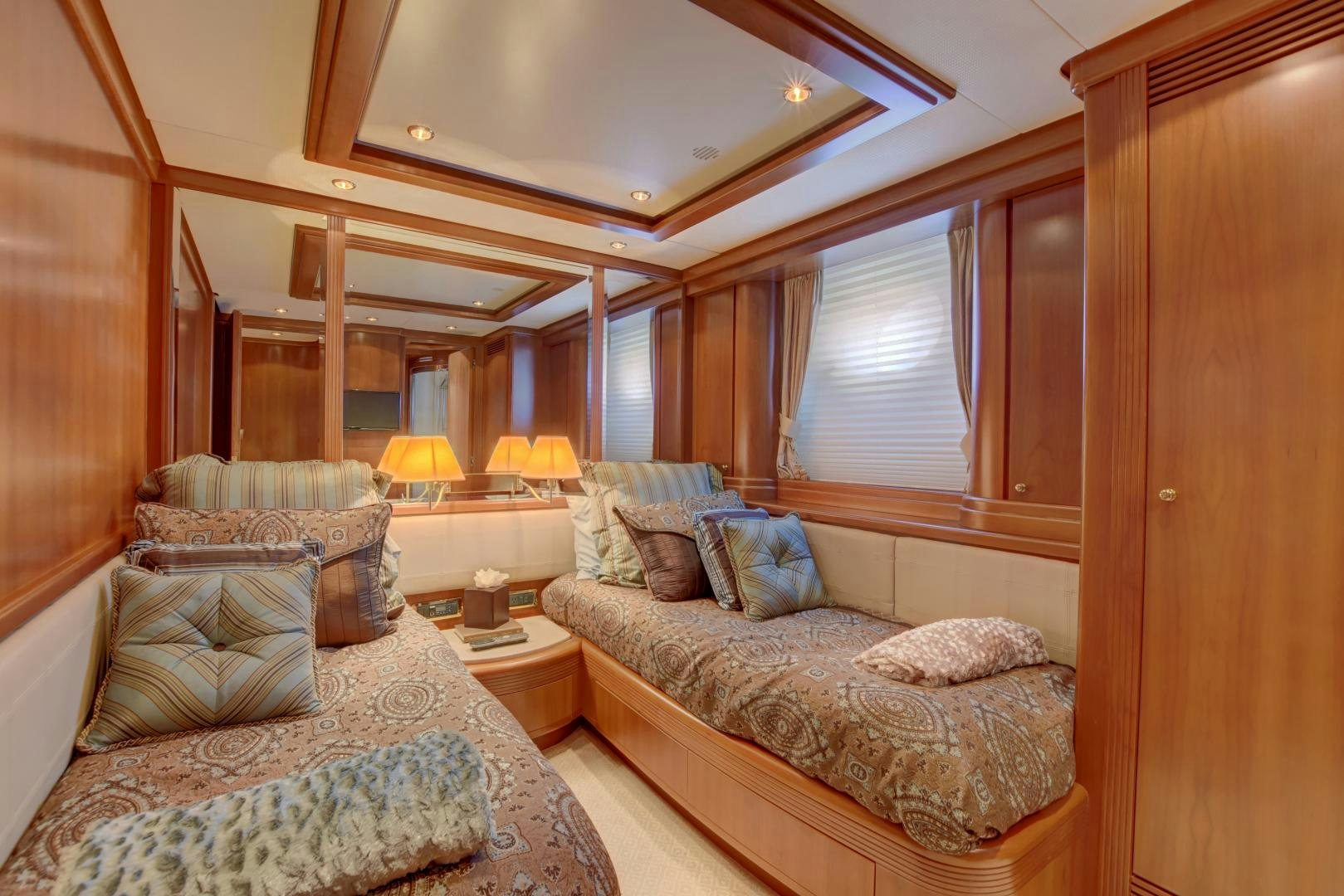 a room with a bed and a couch aboard SIN OR SWIM Yacht for Sale