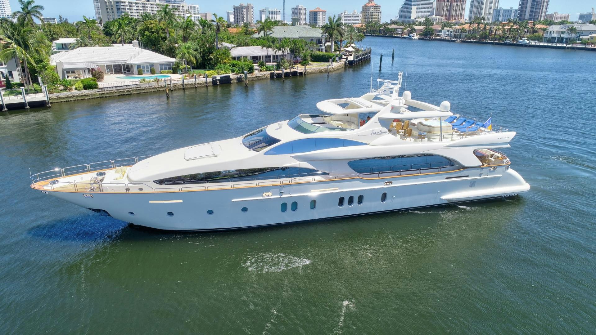 a white boat on the water aboard SIN OR SWIM Yacht for Sale