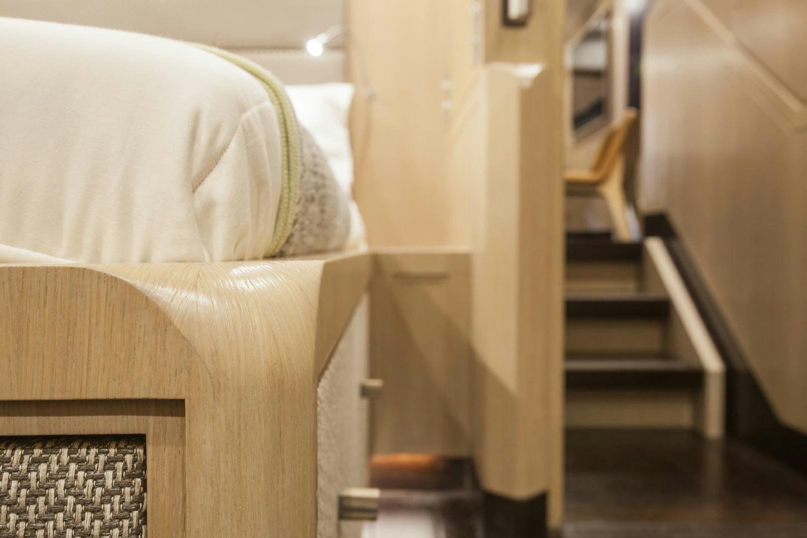 a room with a bed and a staircase aboard ODIN  Yacht for Sale