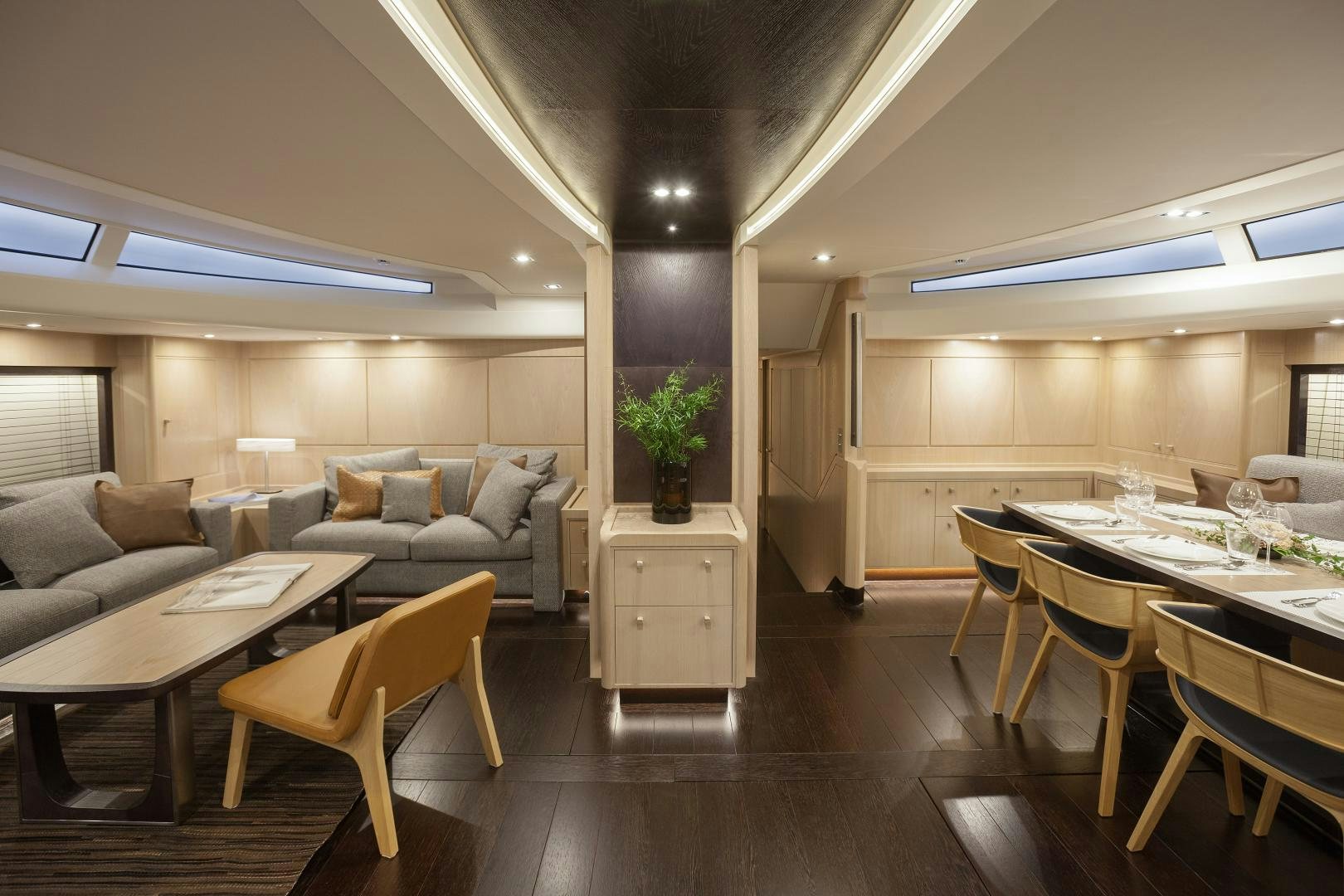 a living room with a table and chairs aboard ODIN  Yacht for Sale