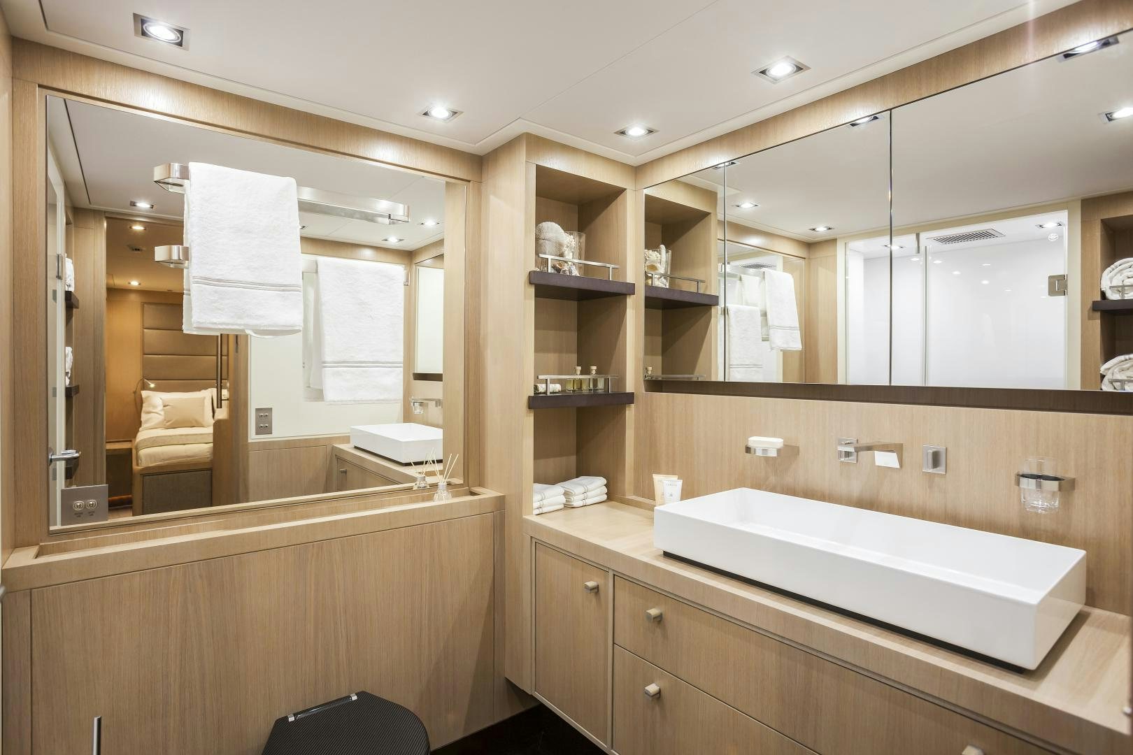 a bathroom with a large mirror aboard ODIN  Yacht for Sale