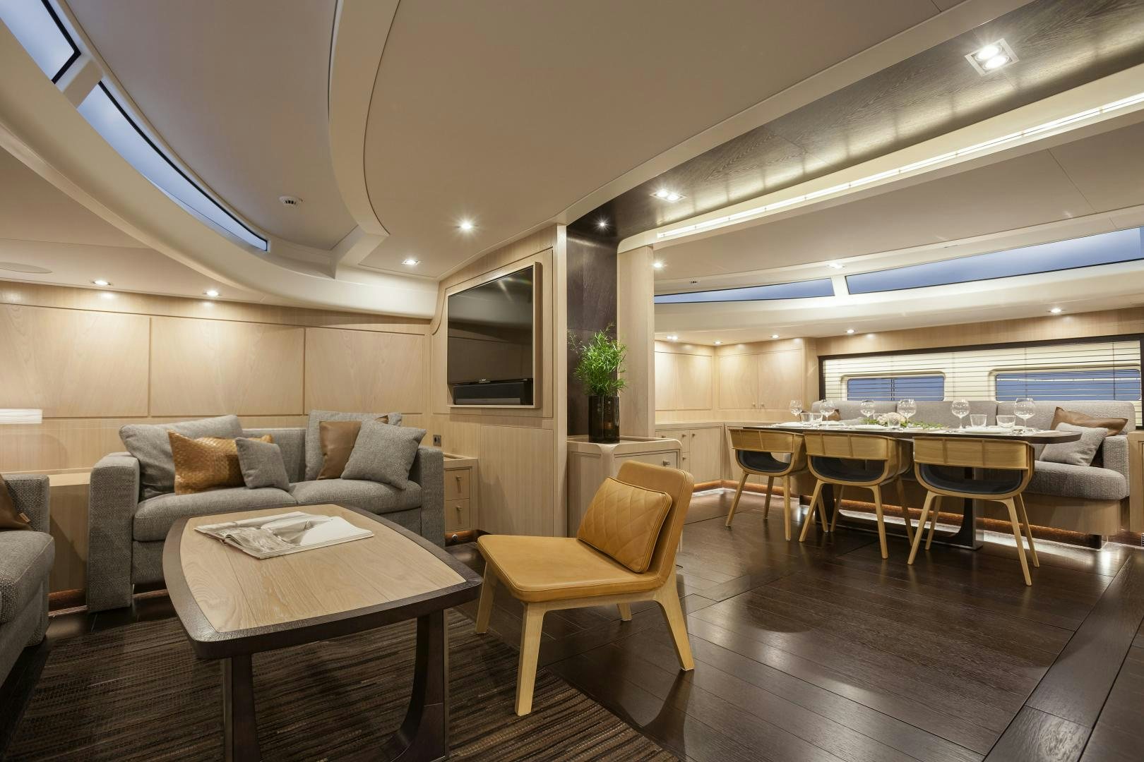 a living room with a couch and a table aboard ODIN  Yacht for Sale