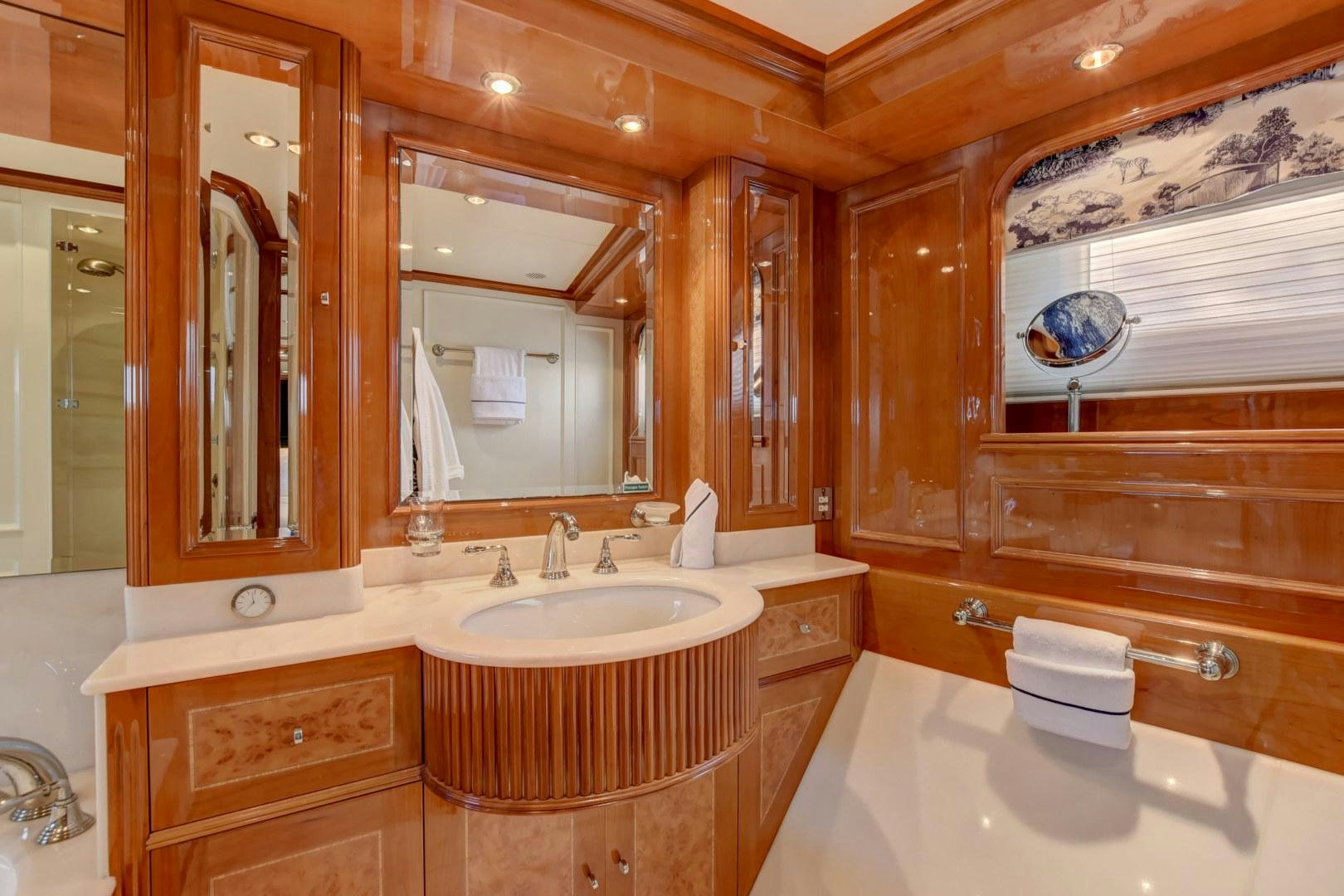a bathroom with a large mirror aboard PARADIGM Yacht for Sale