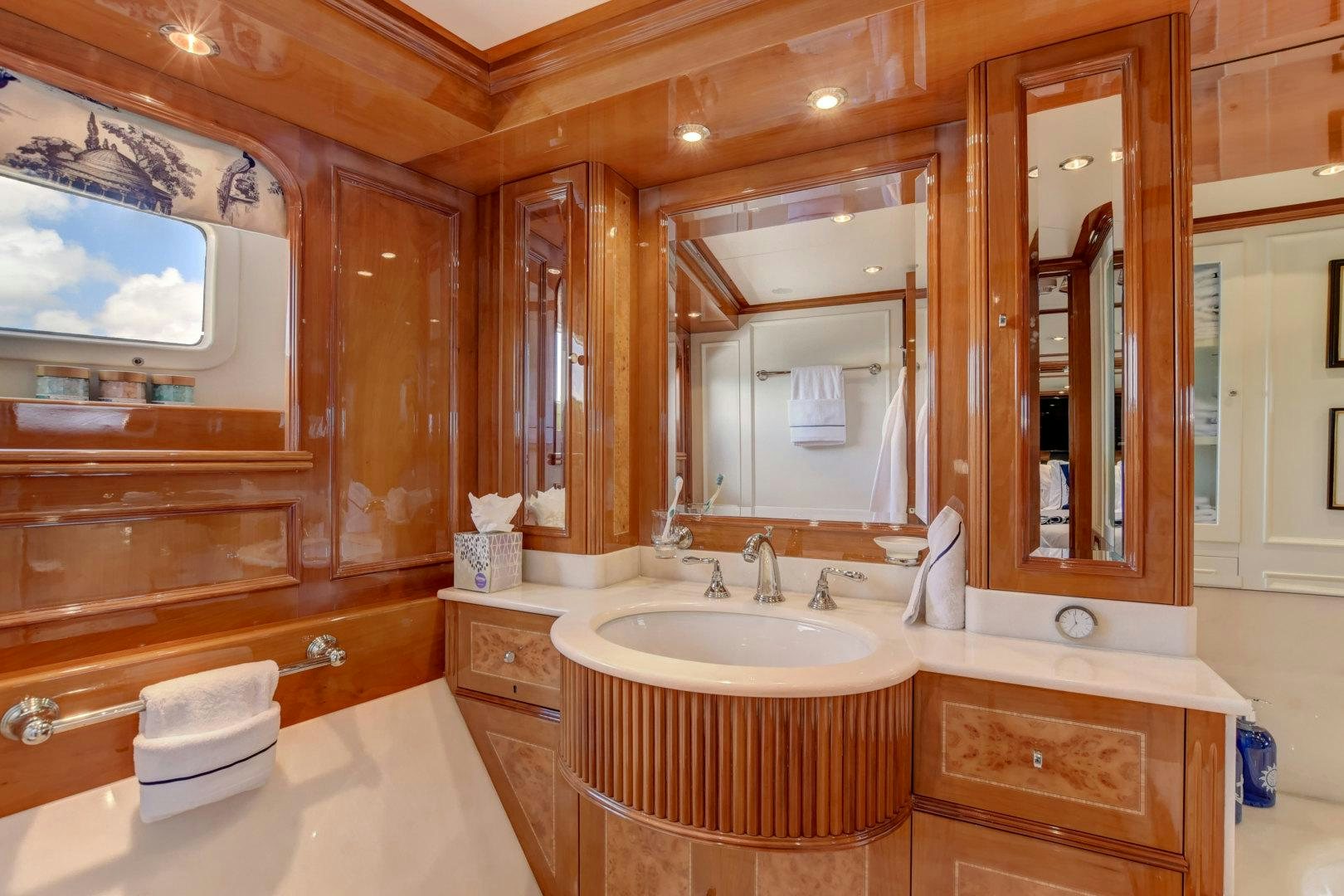 a bathroom with a large mirror aboard PARADIGM Yacht for Sale