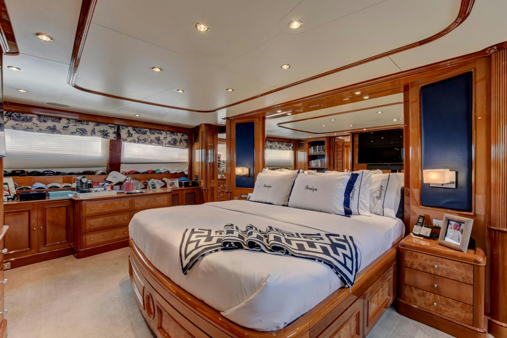 a bedroom with a large bed aboard PARADIGM Yacht for Sale