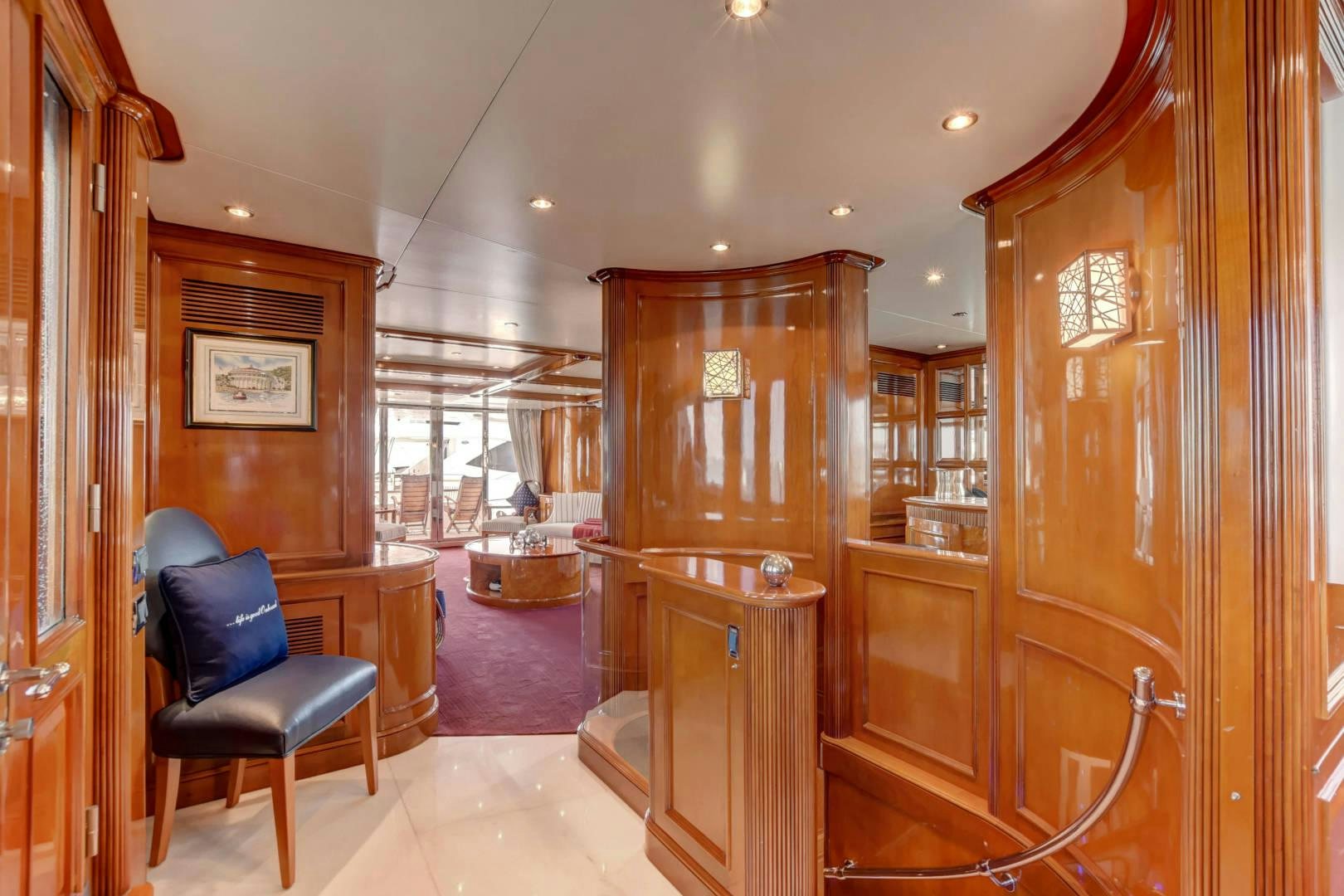 a room with a chair and a desk aboard PARADIGM Yacht for Sale
