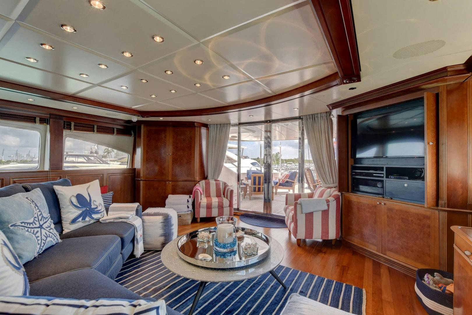a living room with a large glass window aboard PARADIGM Yacht for Sale
