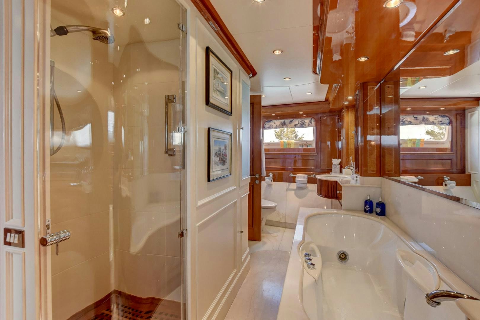a bathroom with a bathtub and shower aboard PARADIGM Yacht for Sale