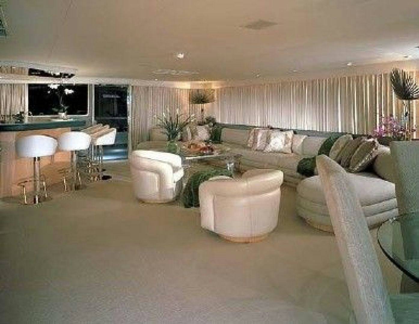 a living room with a couch and a table aboard THUNDERBALL Yacht for Sale