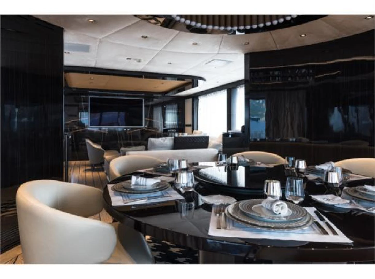 a room with a table and chairs aboard GTT 115 HYBRID Yacht for Sale
