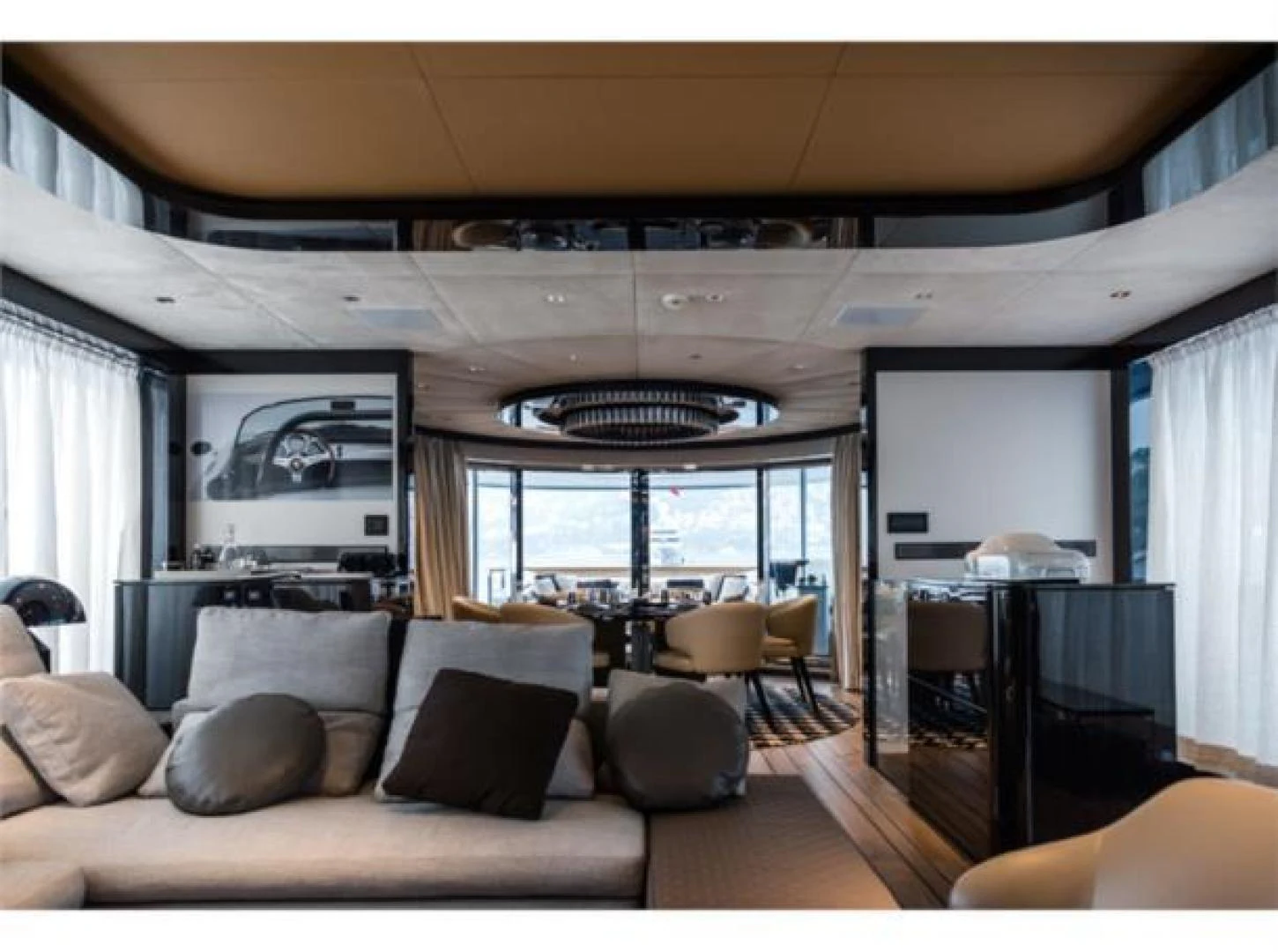 a living room with a large window aboard GTT 115 HYBRID Yacht for Sale