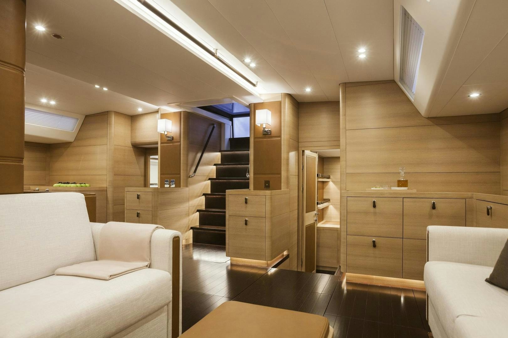 a room with a staircase and a couch aboard DARLIN Yacht for Charter