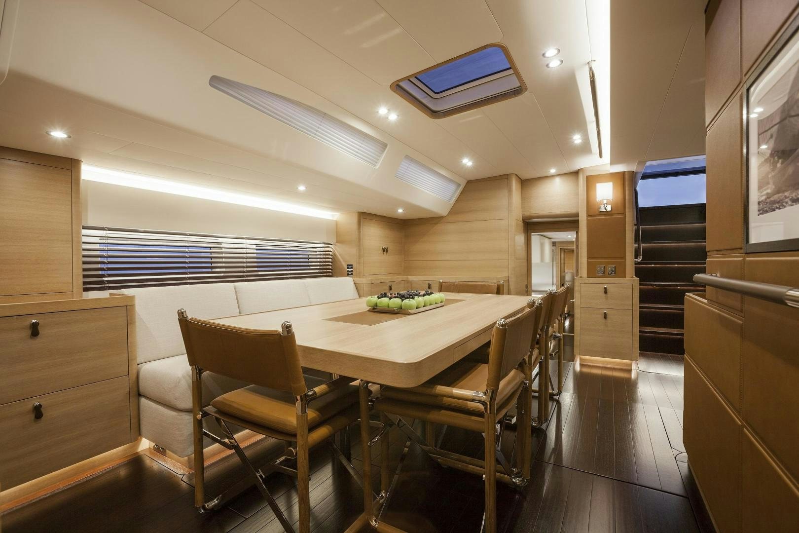 a room with a table and chairs aboard DARLIN Yacht for Sale