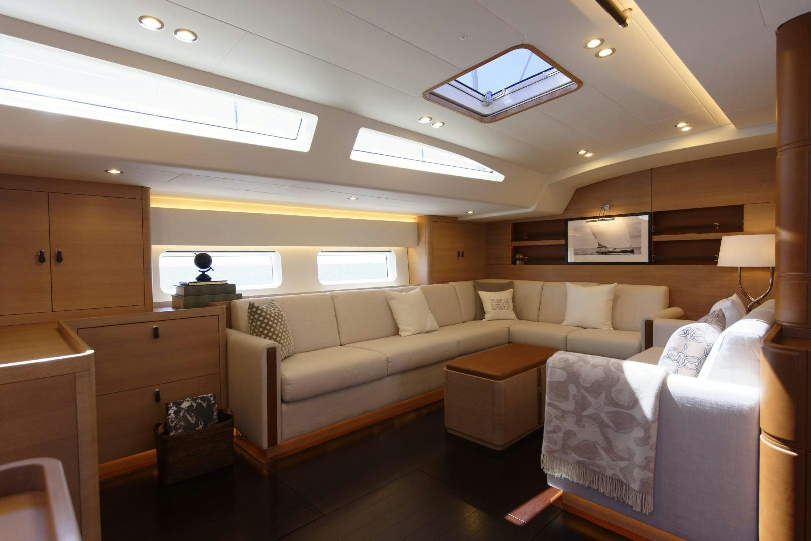 a living room with a couch and a table aboard DARLIN Yacht for Sale