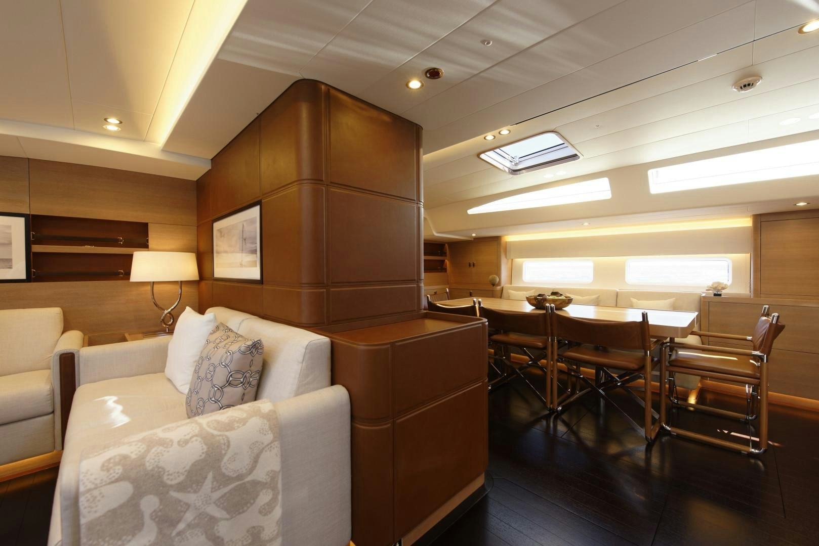 a living room with a couch and a table aboard DARLIN Yacht for Sale
