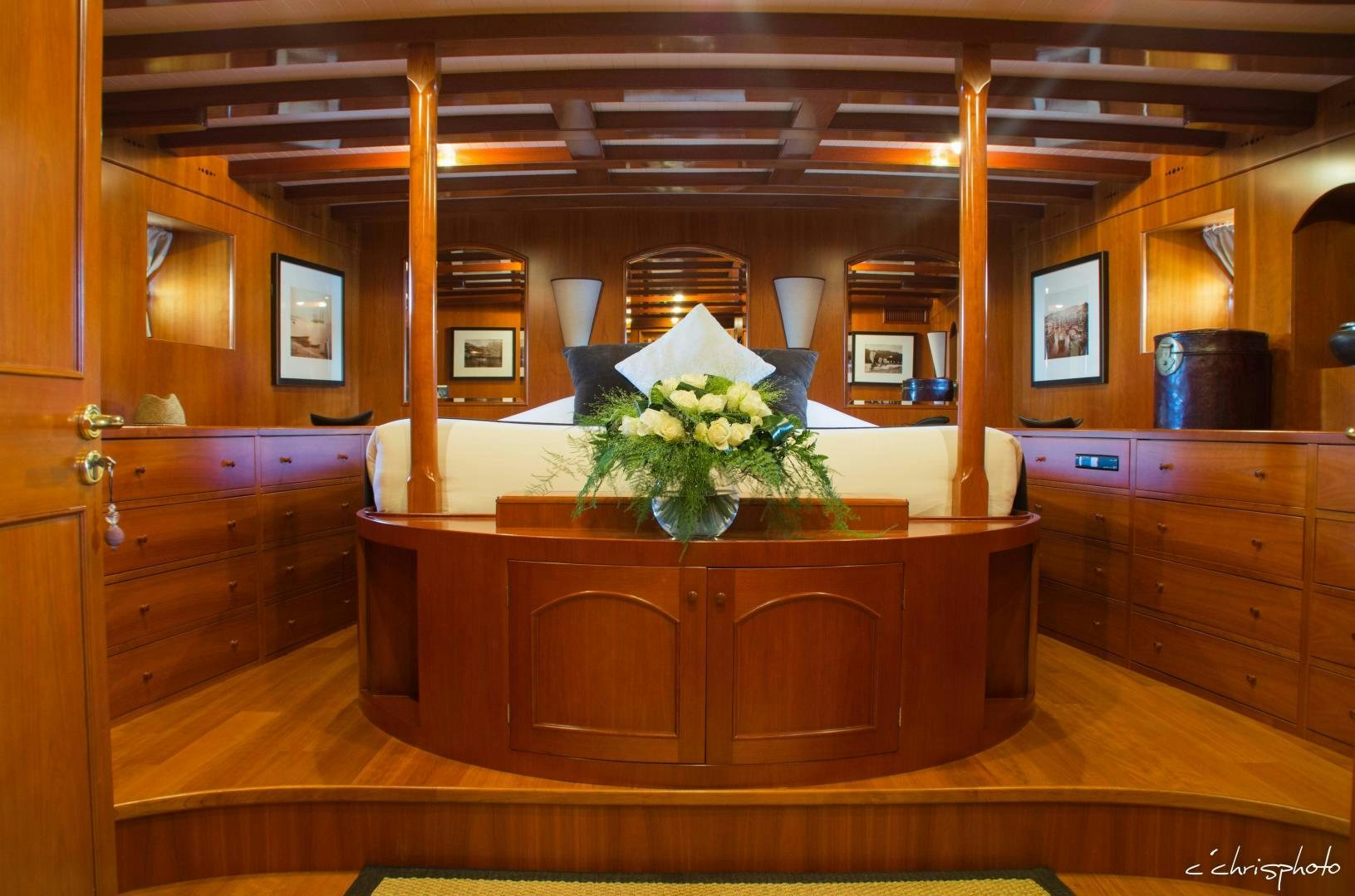 a wooden cabinet with a plant in it aboard OVER THE RAINBOW OF LONDON Yacht for Sale