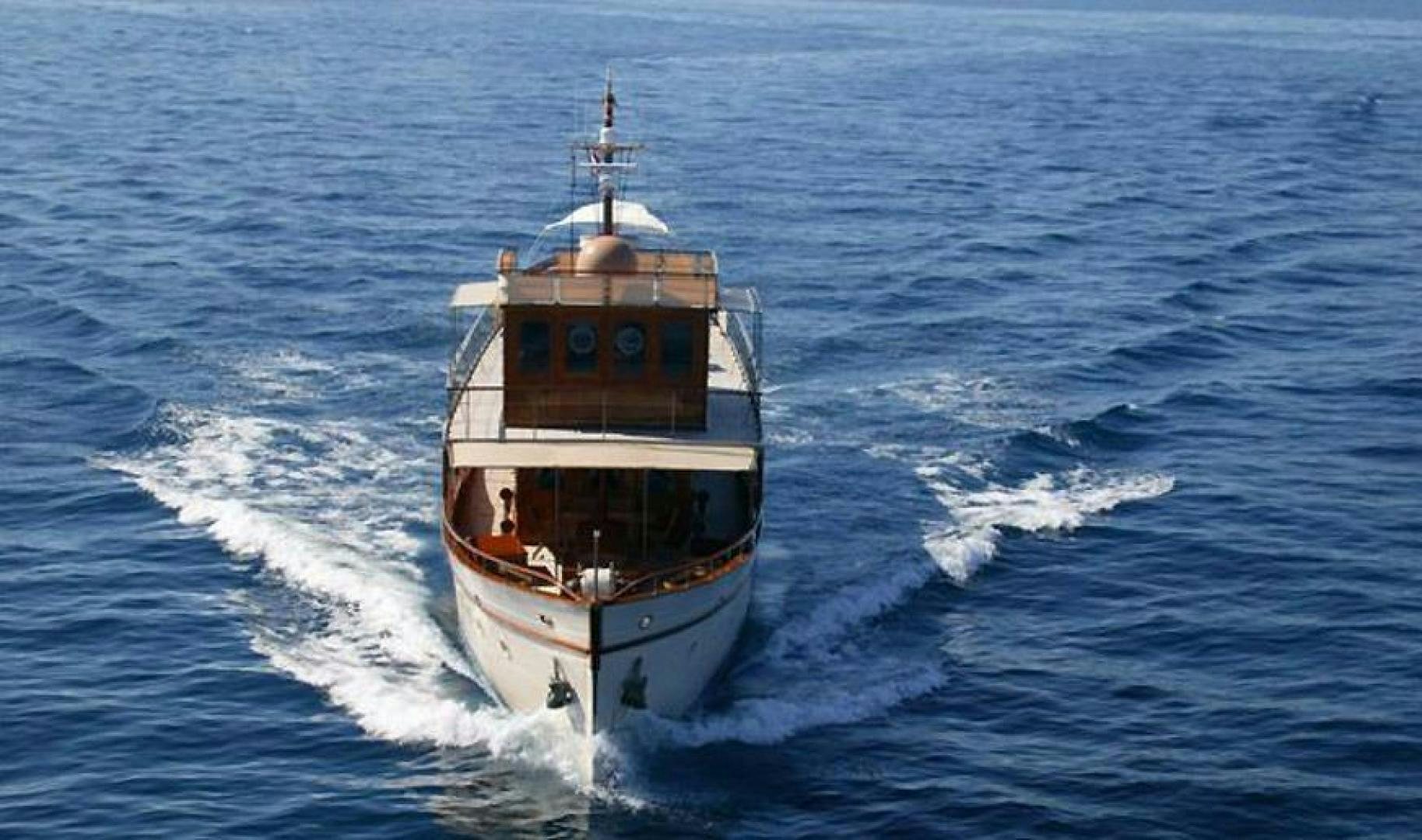 a boat on the water aboard OVER THE RAINBOW OF LONDON Yacht for Sale