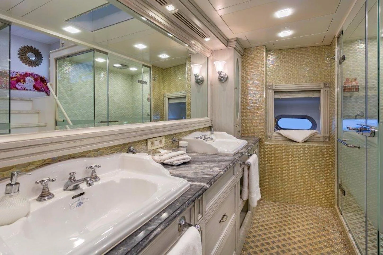a bathroom with a large mirror aboard M&M Yacht for Sale