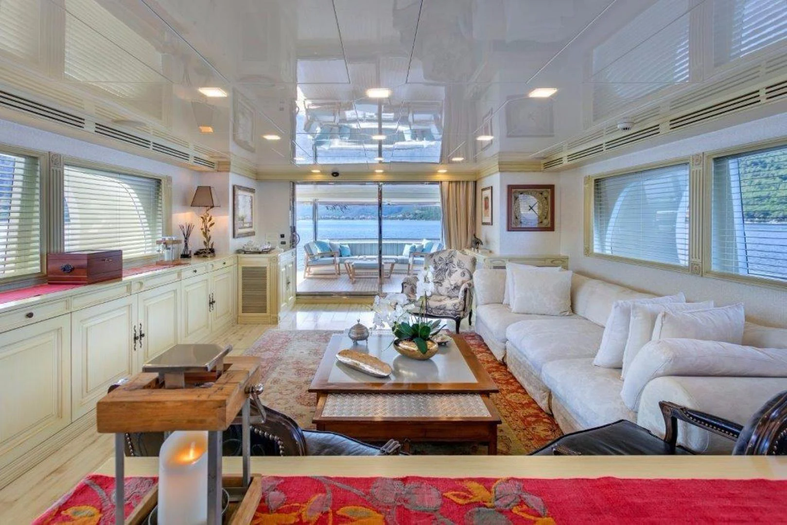 a living room with a large window aboard M&M Yacht for Sale