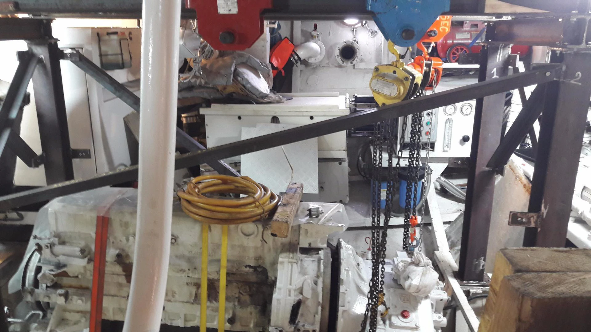 a machine with a large metal cylinder aboard QUEEN SOUTH III Yacht for Sale